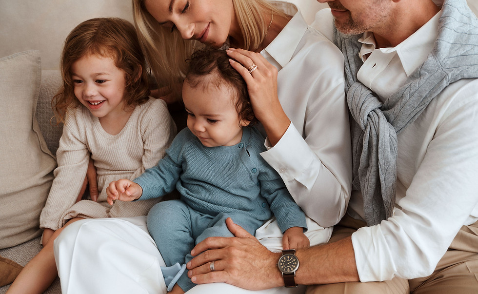 Family sitting together on a couch